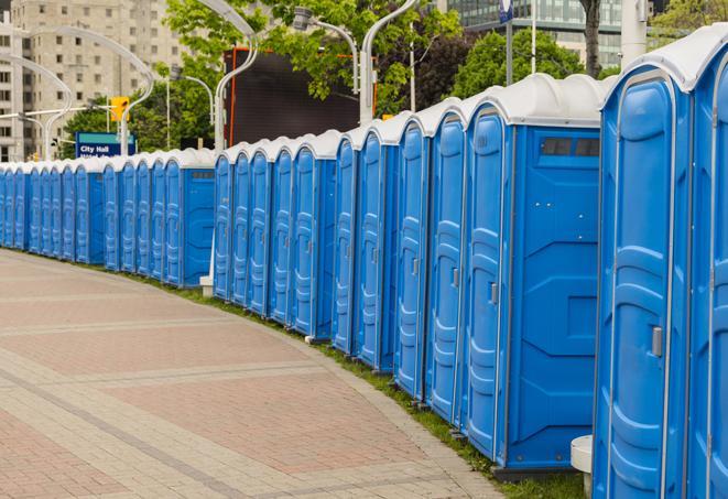 a row of sleek and modern portable restrooms at a special outdoor event in Anamosa