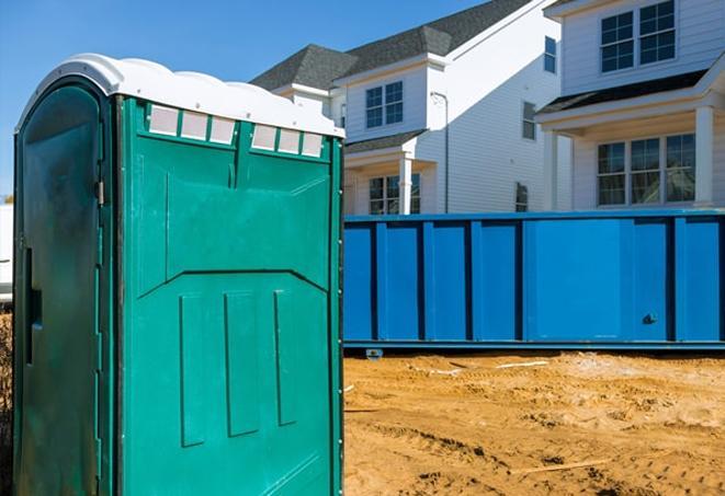 a row of porta potties at a work site